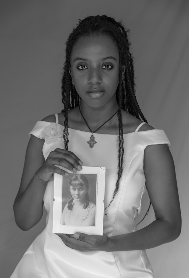 In the photo "Masantu With Our Urgroßmutter," photographer Francesca Hummler had her sister, Masantu, hold a photo of their great-grandmother. (Francesca Hummler)