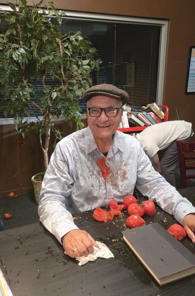 Poway resident Costa Dillon acting in the library scene during filming of "Attack of the Killer Tomatoes: Organic Intelligence" that opened in movie theaters on Aug. 7. (Courtesy of Costa Dillon)