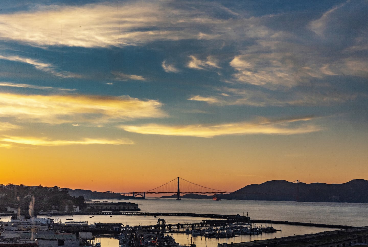 A view of the post-sunset sky and the Golden Gate Bridge in San Francisco.