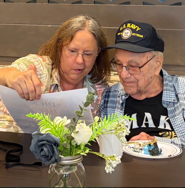 Richard "Dick" Nicholas and his daughter, Judy, during his 102nd birthday celebration on Friday. (MALLORY WALIGORA, FOR THE OAKLAND PRESS)