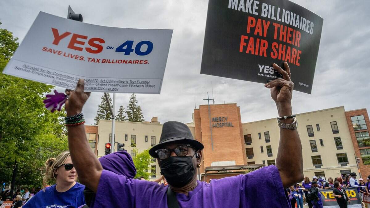 Philip Daniels joins hundreds of frontline healthcare workers from across California in a rally outside Dignity Health Mercy General Hospital on Friday, Aug. 28, to support Proposition 40, which would levy a one-time tax on California billionaires.