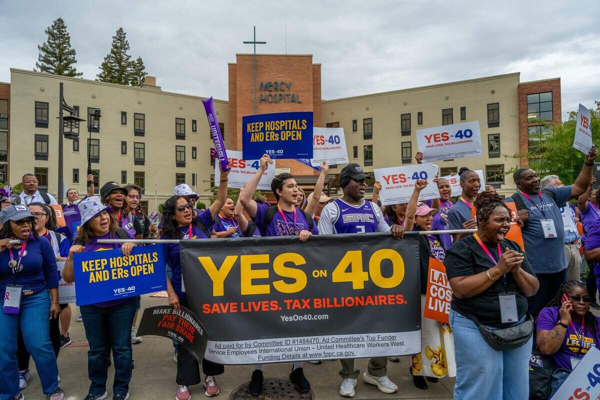 Hundreds of frontline healthcare workers from across California rally outside Dignity Health Mercy General Hospital on Friday to support Proposition 40, which would levy a one-time tax on California billionaires.