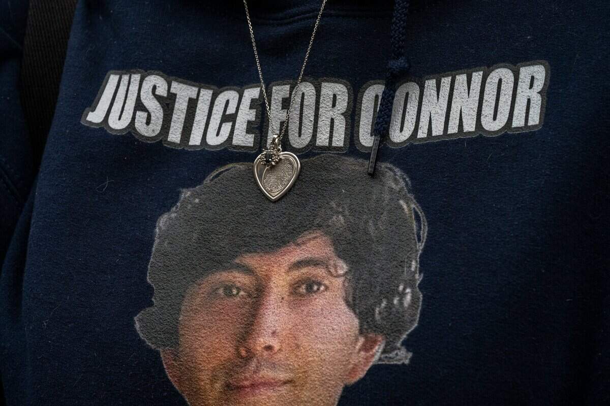 Allison Lyman wears a necklace engraved with her son Connor Elliott Lopez’s fingerprint in Sacramento on Dec. 15 as she attends a court hearing in which defendant Harjit Kaur did not appear. Lyman said the necklace is especially meaningful because Lopez’s piano-playing hands were severely injured in the April 23 crash that killed him.