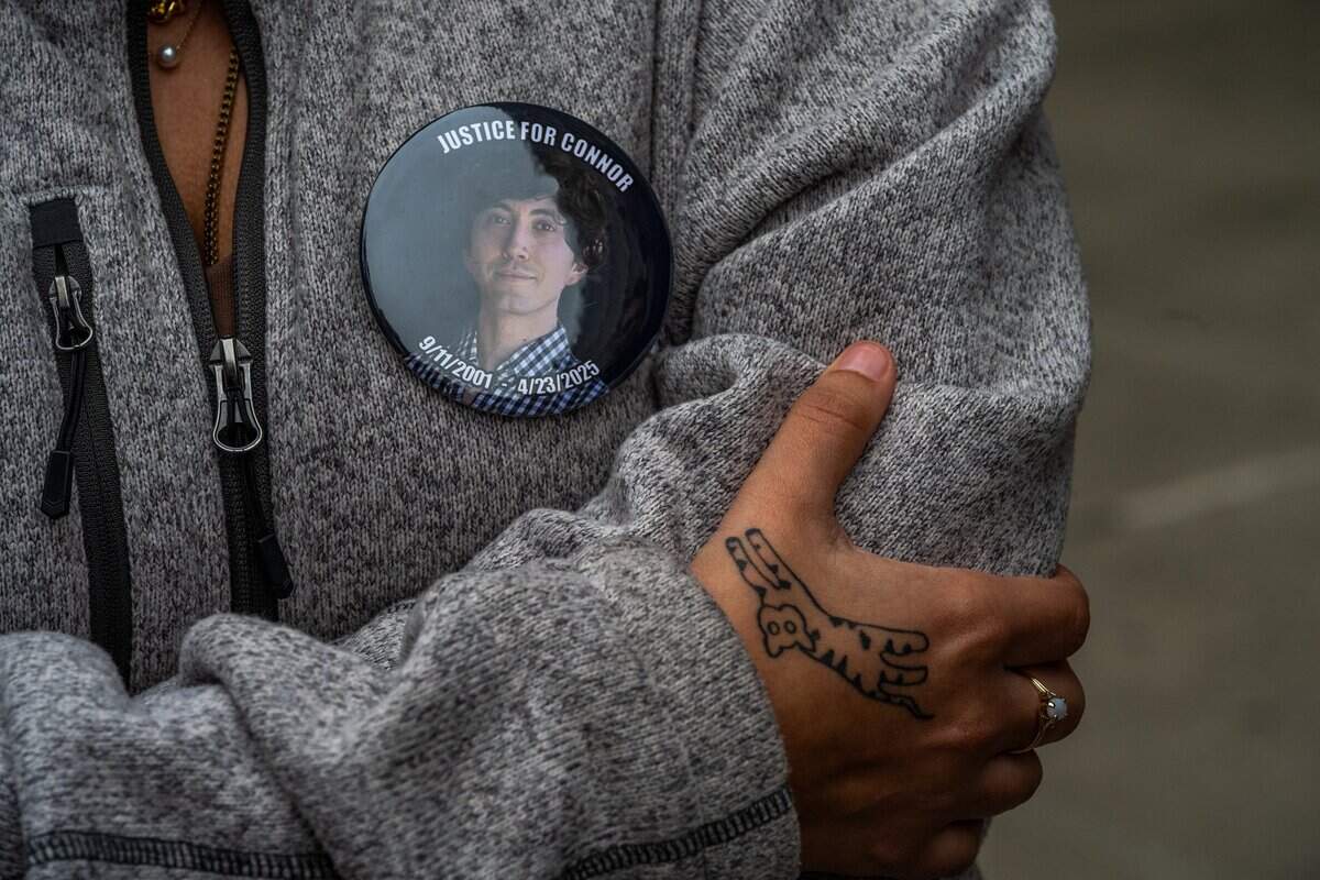 Outside Sacramento Superior Court on Dec. 15, Ella Lopez wears a button with her brother Connor Elliott Lopez’s image and displays a tattoo of his beloved but ill-tempered cat, Benny, in his memory. She was at court after Harjit Kaur did not appear for her arraignment. Kaur killed Lopez when she turned left into the path of his motorcycle.