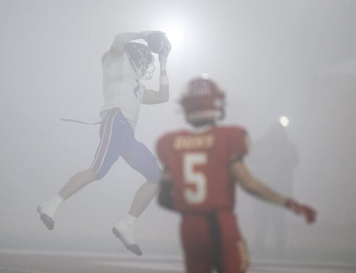 The Folsom Bulldogs' Rob Larson catches a touchdown pass in the first half of the CIF Division 1–AA State Championship football game against the Cathedral Catholic Dons at Saddleback College in Mission Viejo on Friday, Dec. 12.