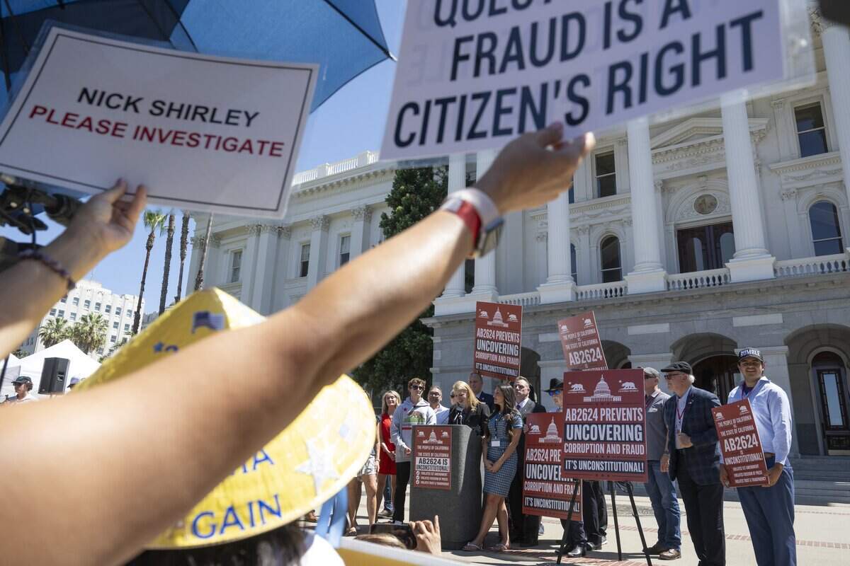 Fans of influencer Nick Shirley cheer during a news conference in opposition to Assembly Bill 2624, also known as "the Stop Nick Shirley Act," at the California Capitol in Sacramento on Wednesday, Aug. 26, 2026. The bill extends an address confidentiality program to immigration service providers.