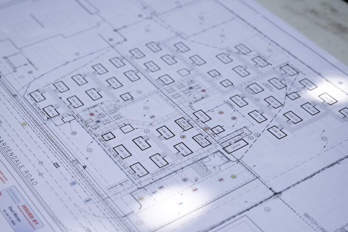 A blueprint shows the plans for the future Gardendale Road micro-community for Sacramento homeless seniors on Thursday. The site will be home to 30 tiny homes as well as separate shared bathroom and kitchen buildings.