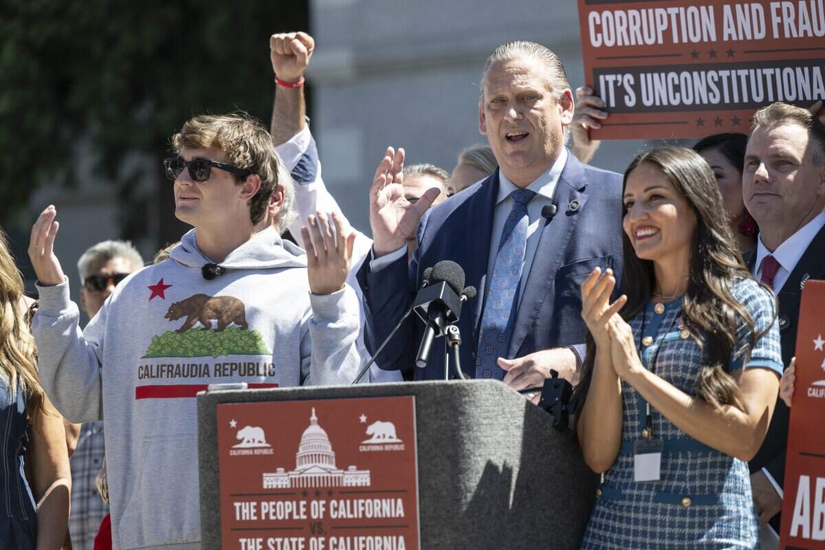 State Sen. Tony Strickland, R-Huntington Beach, introduces influencer Nick Shirley, left, during a rally in opposition to Assembly Bill 2624, also known as the Stop Nick Shirley Act, at the California Capitol in Sacramento on Wednesday, Aug. 26, 2026. The bill extends an address confidentiality program to immigration service providers.