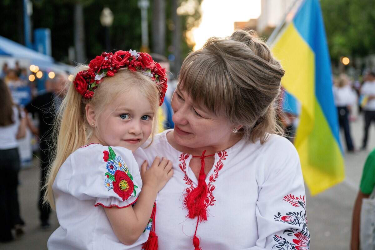 Oksana Husarova, right, and her 4-year-old granddaughter Sara attend an event marking the 35th anniversary of Ukrainian independence at the California Capitol last week.