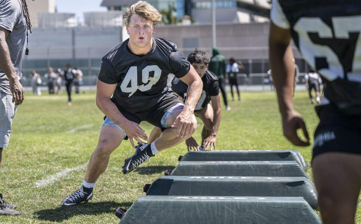 Landen Parry, of Del Oro High School, runs a drill during the Sacramento State Football Rising Stars MEGA Camps on Wednesday, June 10. Parry is the son of former NFL player Josh Parry.