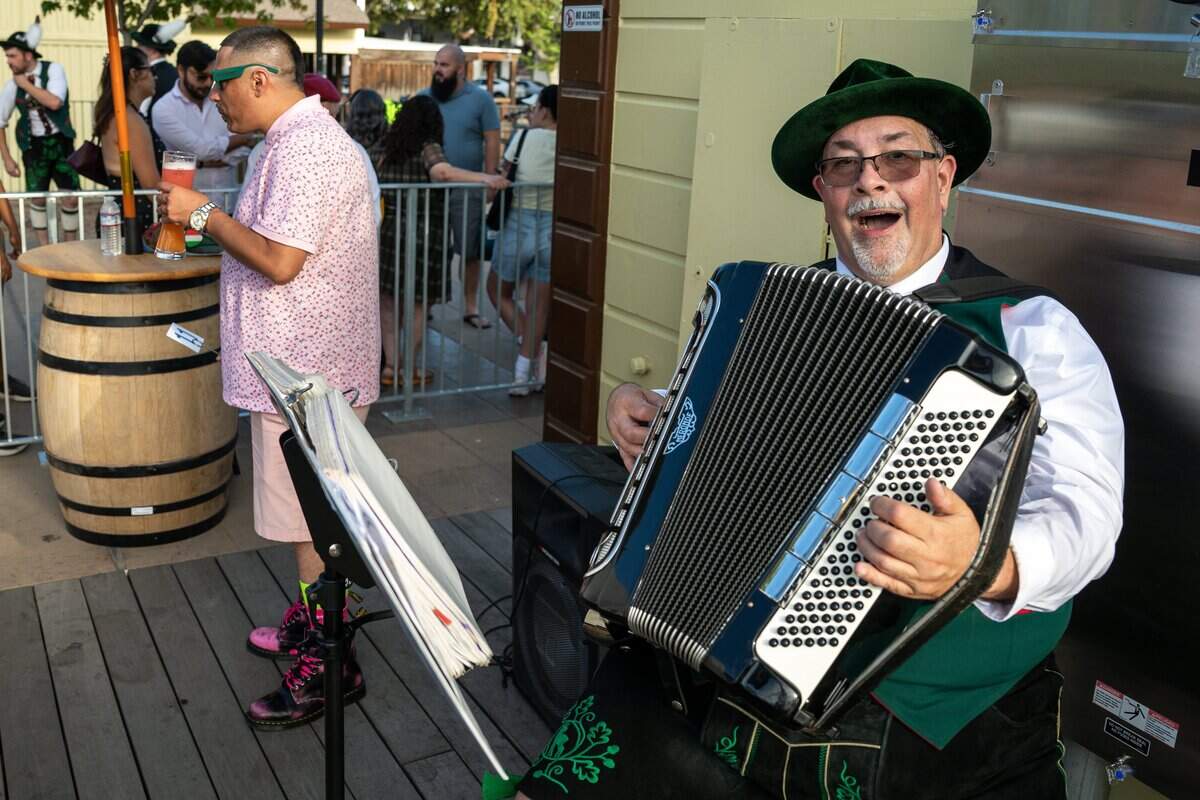 Markus Geissler plays the accordion during the opening of Der Biergarten Waterfront in Sacramento on Friday.