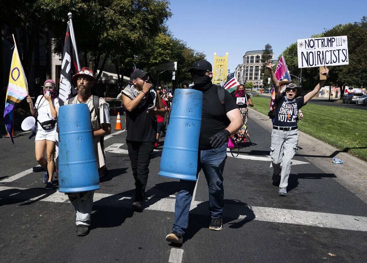 Protesters demonstrate against online political influencer Nick Shirley's appearance at a Republican news conference at the state Capitol on Wednesday, Aug. 26, 2026.