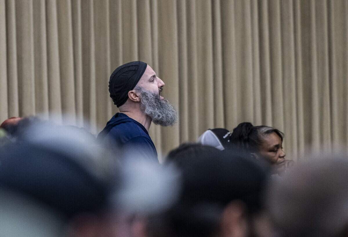 A member of the audience yells at Sacramento City Council members during a meeting on July 28. Moments later, Mayor Kevin McCarty called for a recess.