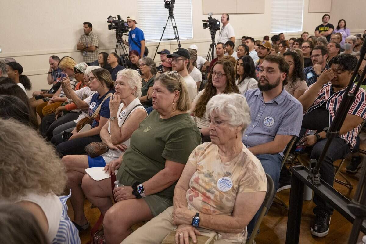 Spectators listen as Congressional District 7 candidates Doris Matsui and Mai Vang participate in a debate-style forum at the Coloma Center Auditorium in Sacramento on Thursday, Aug. 27, 2026.