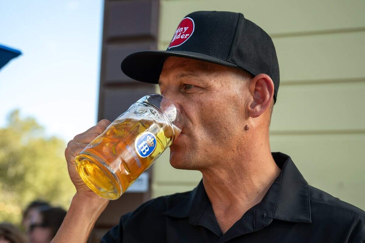 Sacramento Mayor Kevin McCarty drinks a mug of beer at the opening of Der Biergarten Waterfront in Old Sacramento on Friday.