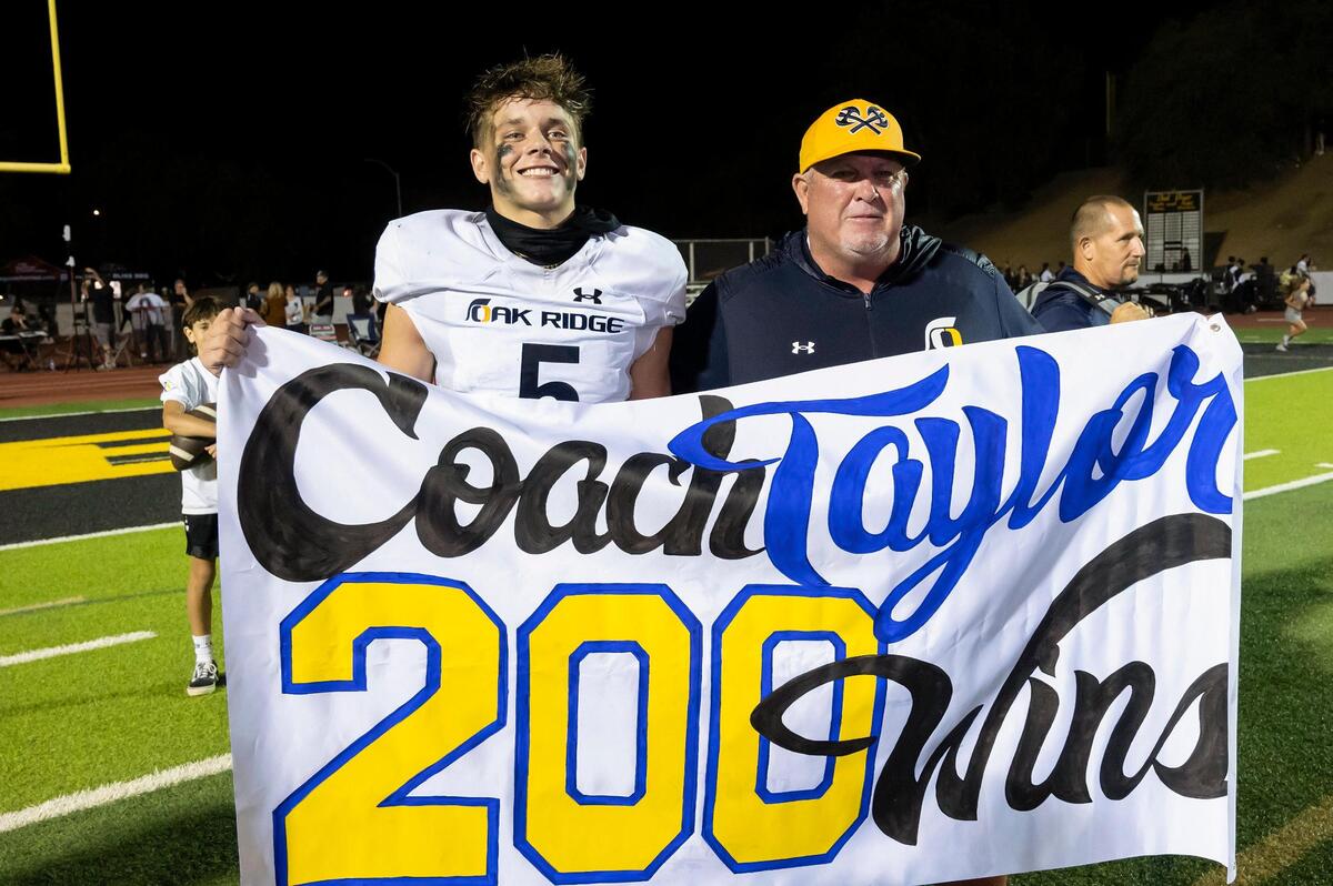 Oak Ridge coach Casey Taylor poses for a photo with his son Jackson Taylor after their win against the Del Oro Golden Eagles in 2023. It was Taylor’s 200th career win, ad it came against Del Oro in Loomis, where he won 149 of those games.