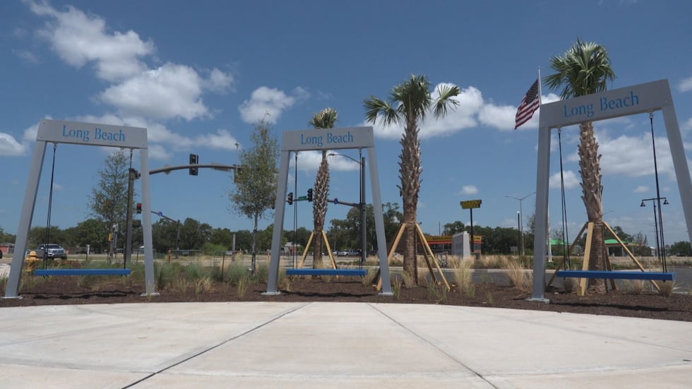 Custom-branded swings will greet visitors as they step onto the plaza.