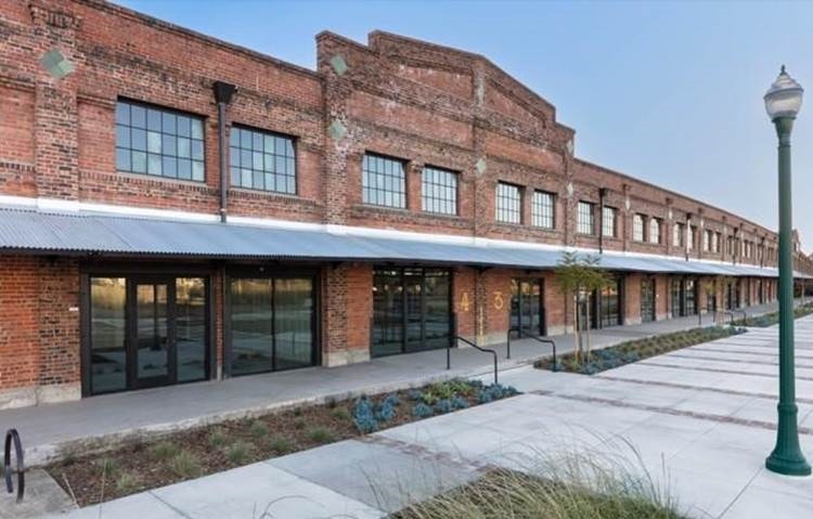 East Bay apartment complex is nearly full and starts adding retailers