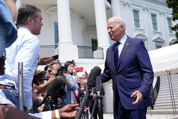 President Joe Biden briefly talks with Peter Alexander and other reporters as he heads to Marine One on the South Lawn of the White House in Washington in July 2021, to spend the weekend at Camp David. (AP Photo/Susan Walsh)