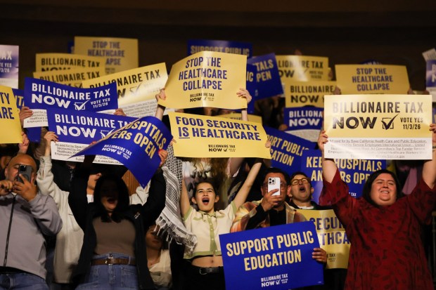 Attendees cheer during the speach of US Senator Bernie Sanders, Independent of Vermont, during the campaign kickoff for the California Billionaire Tax Act at The Wiltern in Los Angeles, February 18, 2026. Sanders is seeking the support of California voters for a November's ballot initiative of an emergency tax on billionaires to help the state's healthcare system. (Photo by Patrick T. Fallon / AFP via Getty Images)