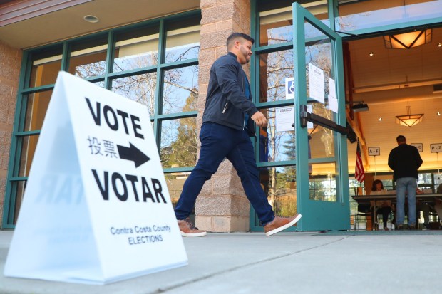 A voter walks into a polling station at Mt. Diablo Unitarian Universalist Church on Tuesday, March 3, 2020, in Walnut Creek, Calif. (Aric Crabb/Bay Area News Group)