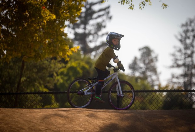 Julian Liao, 6, of Campbell, rides his bike on the BMX course at Calabazas Park in San Jose, Calif., on Wednesday, Aug. 12, 2026. (Shae Hammond/Bay Area News Group)