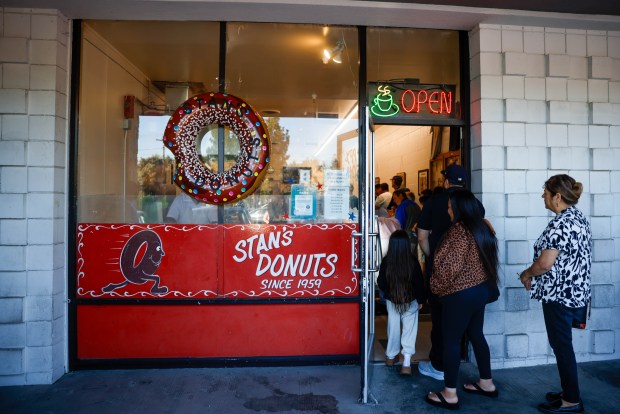 Longtime customers of Stan's Donut Shop in Santa Clara came out to show their support for the local business on July 31, the day a competitor opened nearby. (Shae Hammond/Bay Area News Group)