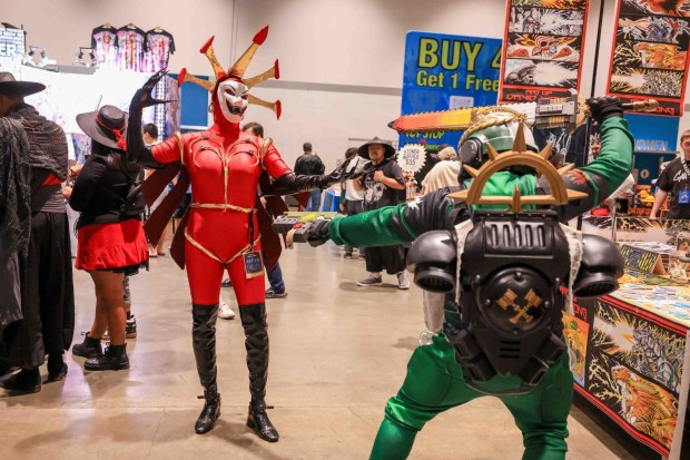 Selina de Vestige, left, dressed as Hexadecimal from "ReBoot," and Josef Aranda, dressed as a Salamander Space Marine from "Warhammer 40,000," attend GalaxyCon San Jose at the San Jose McEnery Convention Center in San Jose, Calif., on Friday, Aug. 28, 2026. (Ray Chavez/Bay Area News Group)
