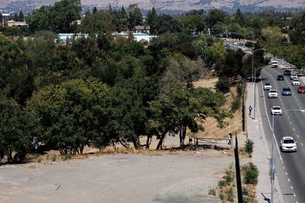 The site of the former large homeless encampment "The Jungle" is visible from The Charles, a 99-unit apartment complex for low-income and formerly homeless people, Aug. 5, 2026, in San Jose, Calif. (Dai Sugano/Bay Area News Group)