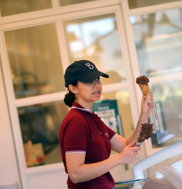 Assistant general manager Manuela Montoya, center, works the gelato counter at Bacio di Latte in the Stanford Center on Wednesday, July 29, 2026, in Palo Alto, Calif. (Aric Crabb/Bay Area News Group)