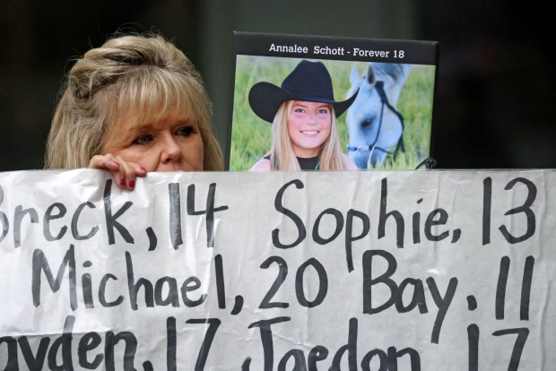 Lori Schott holds a photograph of her daughter Annalee during a rally outside a federal courthouse on Tuesday, Aug. 18, 2026, in Oakland, Calif. Parents and advocates gathered in front of the courthouse holding a large banner with the names of children who died from what they claim are social media related harms. Opening statements begin on Tuesday in the landmark federal multi-state social media addiction trial against Meta. (Aric Crabb/Bay Area News Group)