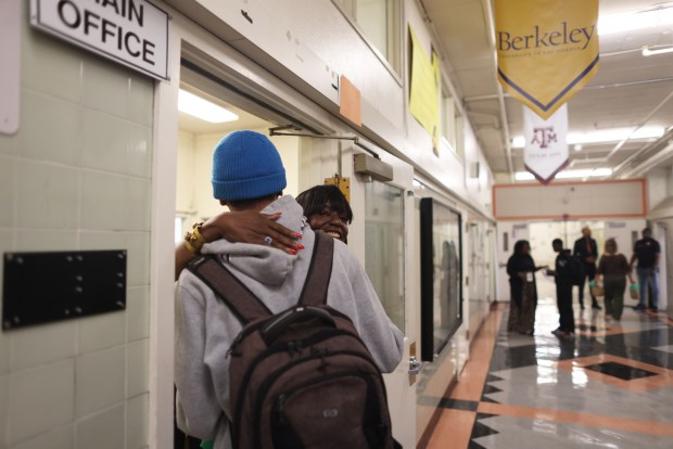 Dr. Denise Saddler, center, superintendent of the Oakland Unified School District, gets a hug from a student on the first day of school at McClymonds High School on Monday, Aug. 10, 2026, in Oakland, Calif. (Aric Crabb/Bay Area News Group)