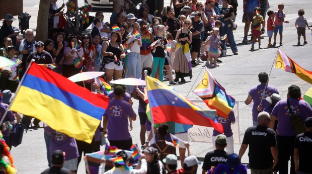 Community members watch people walk south on Market Street during the Silicon Valley PRIDE Parade in downtown San Jose, Calif., on Sunday, Aug. 30, 2026. (Nhat V. Meyer/Bay Area News Group)
