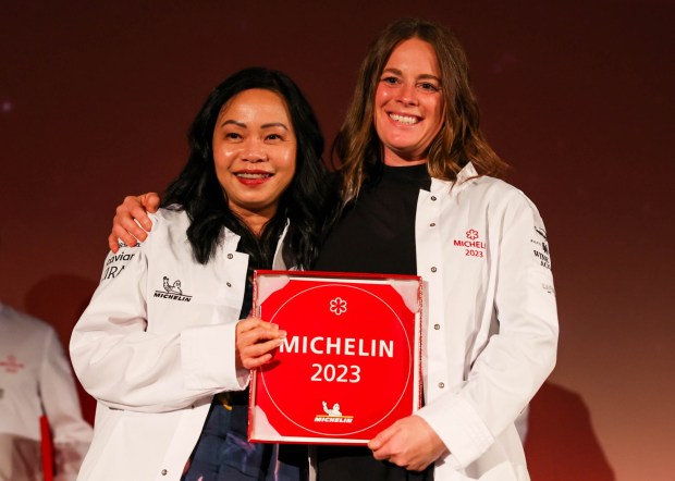 Nari restaurant chef and owners Pim Techamuanvivit, left, and Meghan Clark, of San Francisco, look on after they were awarded with a one-Michelin-star award and Michelin jackets during the Michelin Guides International event at Chabot Space and Science Center in Oakland, Calif., on Tuesday, July 18, 2023. (Ray Chavez/Bay Area News Group)