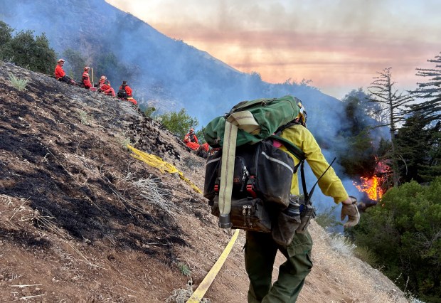 Firefighters battled the Timber Fire, burning in Los Padres National Forest east of Highway 1, which was 1,300 acres with 5% containment by Monday afternoon. (Photo courtesy of Big Sur Fire)