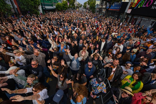 Music fans swarm Haight street as they sing with Train lead vocalist Pat Monahan while his band performs in front of the Mad Dog in the Fog in San Francisco on Thursday, Aug. 27, 2026. (Jose Carlos Fajardo/Bay Area News Group)