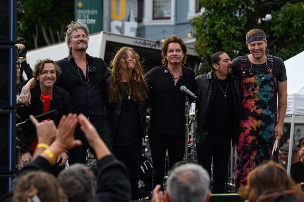 Train lead singer Pat Monahan, center behind microphone, is joined by his band members as they take a final bow on stage in front of the Mad Dog in the Fog in San Francisco on Thursday, Aug. 27, 2026. (Jose Carlos Fajardo/Bay Area News Group)