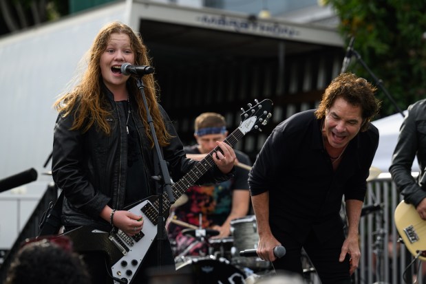 Train lead singer Pat Monahan, right, performs with his son Rock Monahan, age 14, in front of the Mad Dog in the Fog in San Francisco on Thursday, Aug. 27, 2026. (Jose Carlos Fajardo/Bay Area News Group)