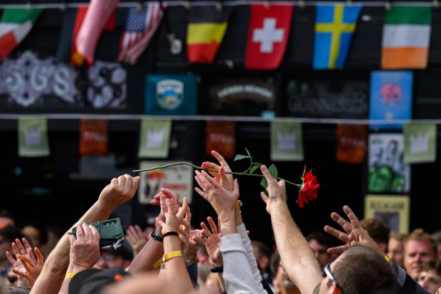 Fans battle for a rose thrown into the crowd by Train lead vocalist Pat Monahan while performing on stage in front of the Mad Dog in the Fog in San Francisco on Thursday, Aug. 27, 2026. (Jose Carlos Fajardo/Bay Area News Group)