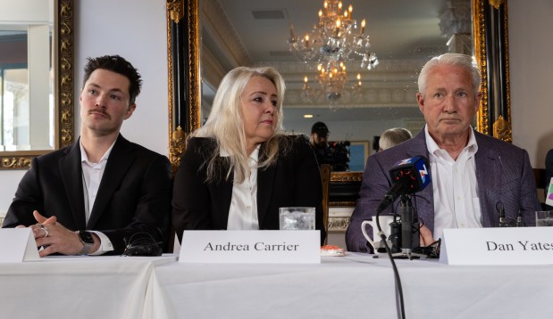 Brandon Yates' brother Ryan Yates, left, mother Andrea Carrier and father Dan Yates announce the filing of their lawsuit against San Diego County and Sheriff Kelly Martinez on Tuesday, Feb. 25, 2025, in San Diego. Brandon Yates was tortured and killed in a jail cell in January 2024.  (Ana Ramirez / The San Diego Union-Tribune)