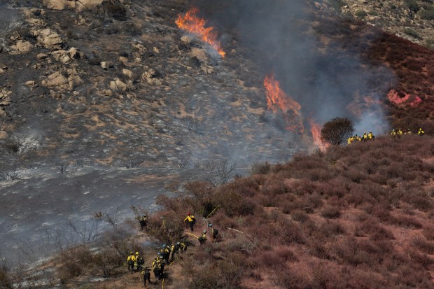 Alpine, CA - Crews battle the Dehesa fire on Wednesday, Aug. 19, 2026, near Alpine, CA. (Luke Johnson / The San Diego Union-Tribune)