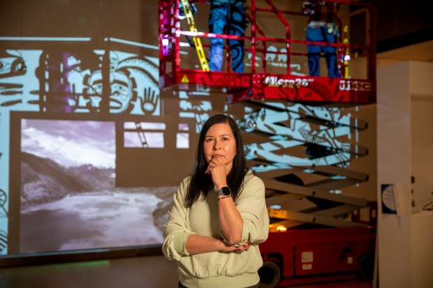 Artist Marianne Nicolson in front of "The Halibut Hooks" during installation at the Mingei International Museum. (Mingei)