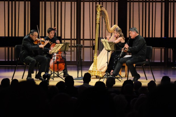 Violinist and former SummerFest Music Director Cho-Liang "Jimmy" Lin made a memorable return Friday night. From left are Lin, cellist Jay Campbell, harpist Julie Smith Phillips and clarinetist John Bruce Yeh. (Ken Jacques)