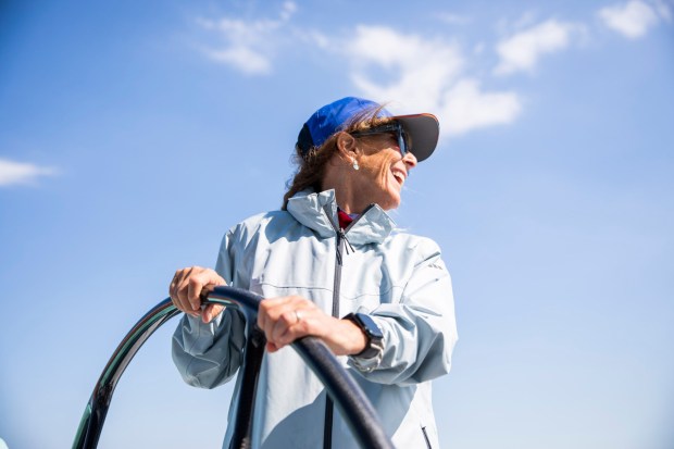 Olympian Annie Gardner at the wheel at a 2025 reunion in Oyster Bay, New York, while filming on location for the "Mighty Mary" documentary. (Richard Schultz. Courtesy of 50 Eggs.)