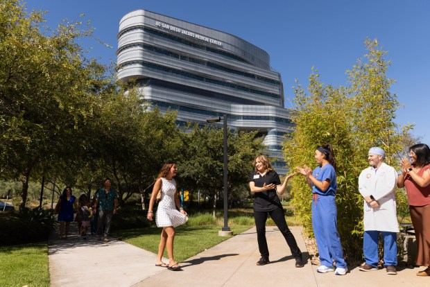 Rachel Vasquez Villalobos meets her care team in front of the East Campus Office Building at UC San Diego Health on Thursday, July 30, 2026, in La Jolla, CA. (Luke Johnson / The San Diego Union-Tribune)
