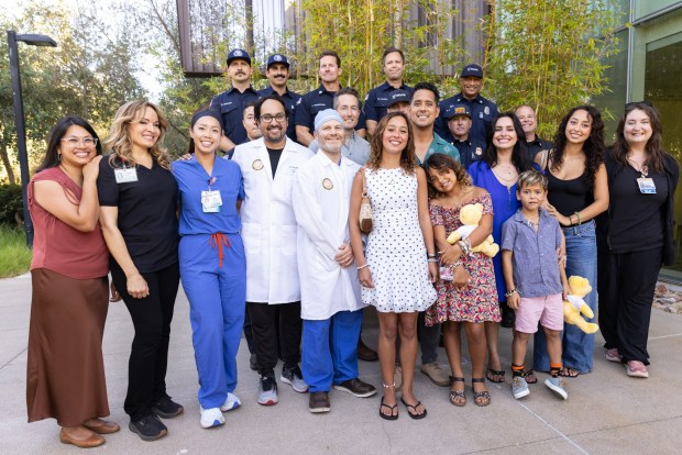 Rachel Vasquez Villalobos meets her care team in front of the East Campus Office Building at UC San Diego Health on Thursday, July 30, 2026, in La Jolla, CA. (Luke Johnson / The San Diego Union-Tribune)