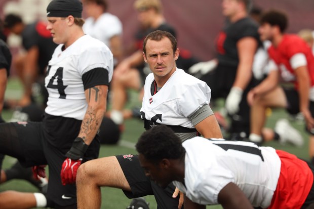 San Diego State's Cooper DiLeva (center) is among the candidates to succeed kicker Gabe Plascencia. (Hayne Palmour IV / For The San Diego Union-Tribune)