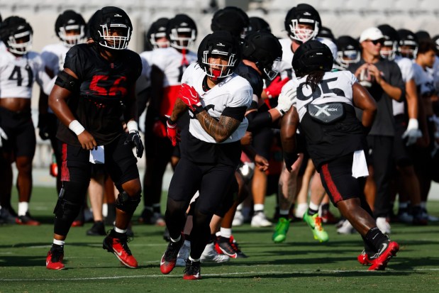 San Diego State linebacker Sione Hala (center) runs through drills during scrimmage at Snapdragon Stadium on Saturday, Aug. 15, 2026 in San Diego, California. (Meg McLaughlin / The San Diego Union-Tribune)