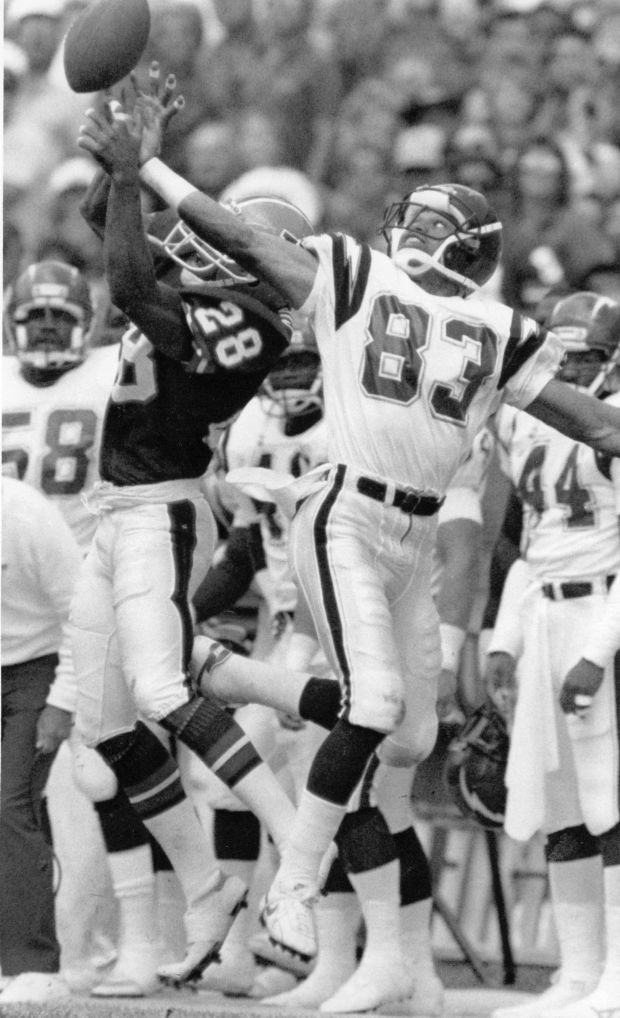 Danvers Jeremiah Castille goes up high with Chargers Anthony Miller for a long pass down the sideline in the first half of play durinng a 1988 game. (John Leyba, Denver Post)