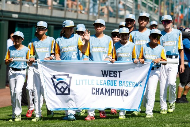 Sweetwater Valley, representing the U.S. West Region, players wave to fans during the Little League World Series Opening Ceremonies at Little League International Complex on Wednesday, Aug. 19, 2026 in Williamsport, Pennsylvania. (Meg McLaughlin / The San Diego Union-Tribune)